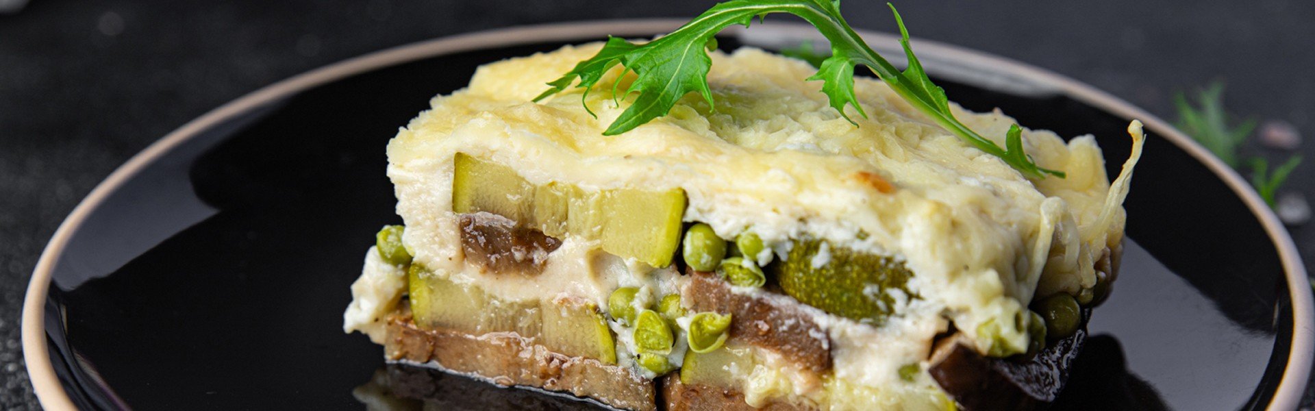2282379311 casserole vegetable lasagne eggplant, zucchini, green peas, cheese, bechamel sauce vegetables meal food snack on the table copy space food background rustic top view