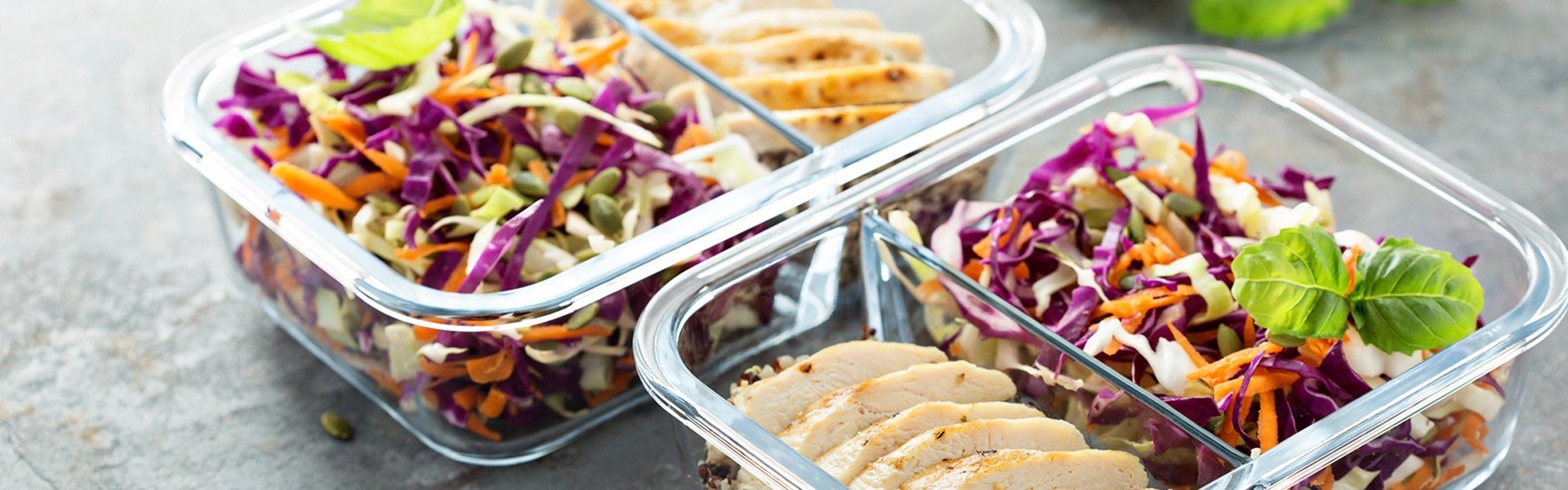 791066053 Healthy meal prep containers with quinoa, chicken and cole slaw
