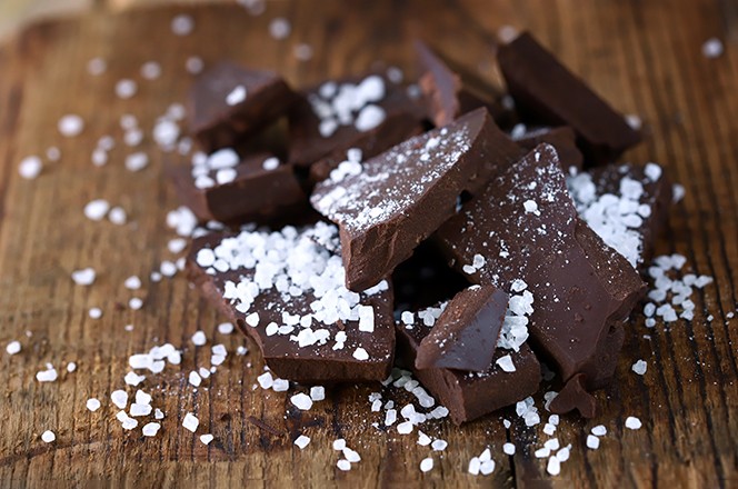 2055892901 Selective focus. Chocolate with sea salt. Salted dark chocolate.