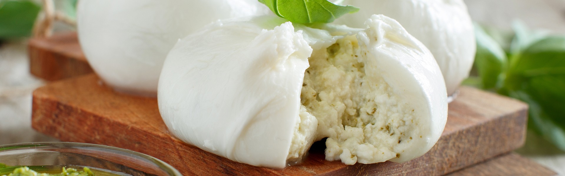 Italian mozzarella cheese stuffed with ricotta and persto close up