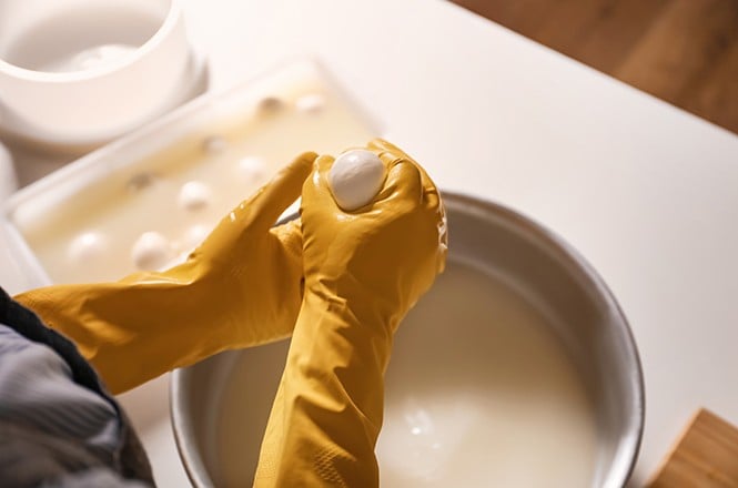 Woman preparing tasty cheese
