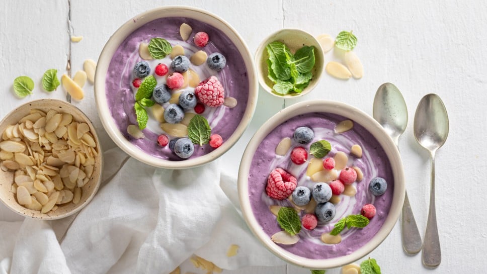 Homemade cream cold soup with frozen berries and mint. Cold soup with berries for summer.