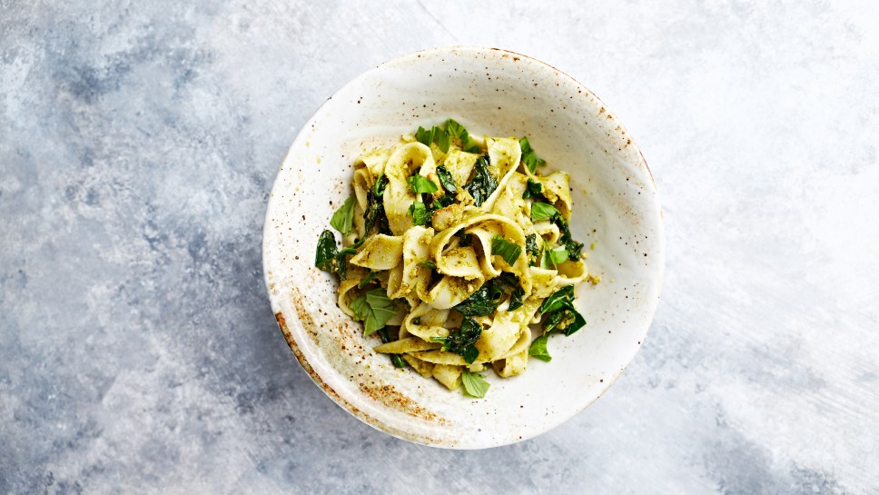 Pasta with cashew pesto and spinach. Mediterranean cuisine. Home made food