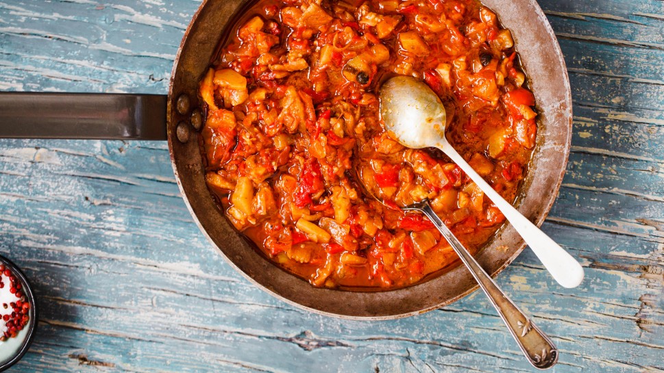 Ratatouille cast iron pan. Stewed vegetables dish.