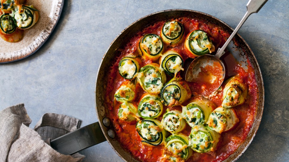 Courgette stuffed with ricotta, spinach and peas in tomato sauce