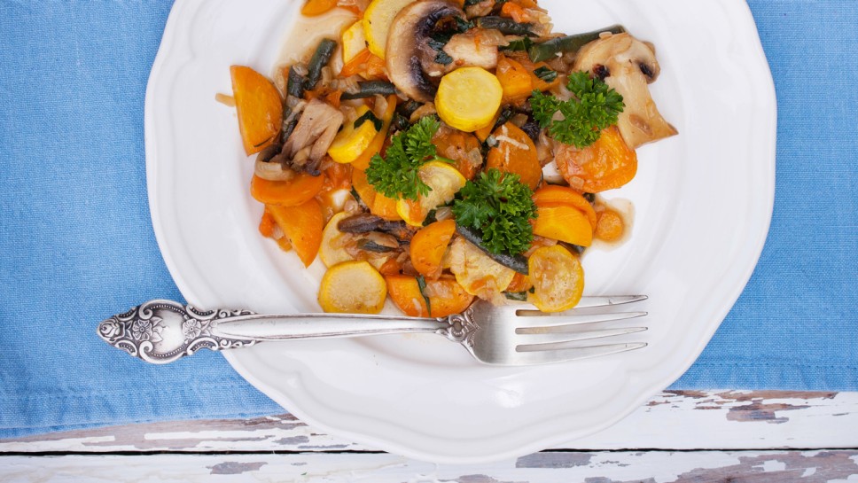 Summer stew with yellow zucchini, mushrooms, carrots and garlic