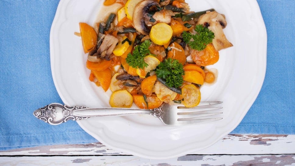 Summer stew with yellow zucchini, mushrooms, carrots and garlic