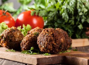 Chickpea falafel balls on a plate with vegetables
