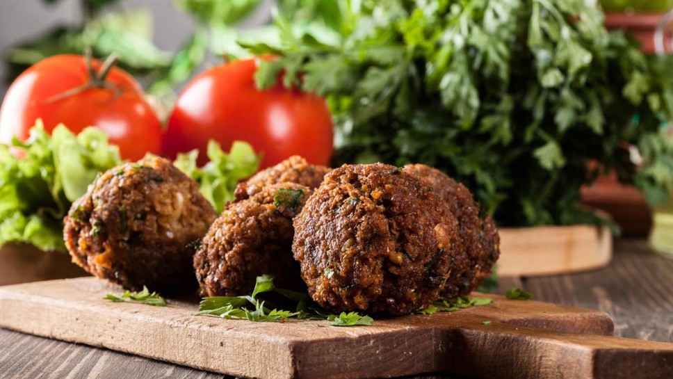 Chickpea falafel balls on a plate with vegetables