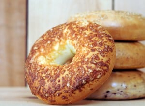  bagels on wooden table at market place 