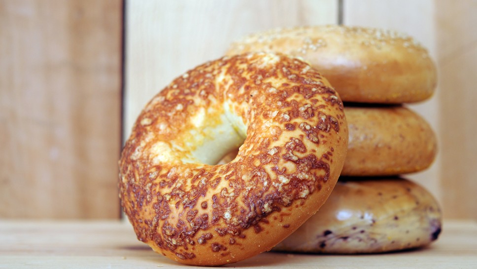  bagels on wooden table at market place 