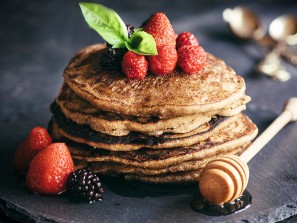 Buckwheat pancakes with berry fruit and honey.Selective focus