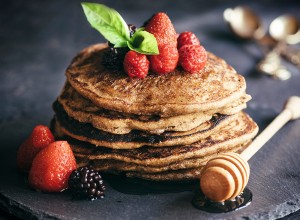 Buckwheat pancakes with berry fruit and honey.Selective focus