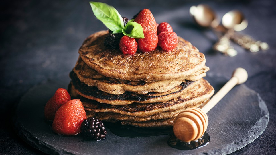 Buckwheat pancakes with berry fruit and honey.Selective focus
