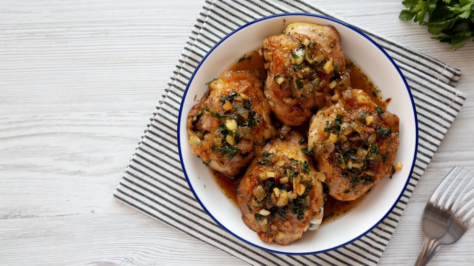 Homemade Garlic Brown Sugar Chicken in a Pan, top view. Overhead, from above, flat lay. Copy space.