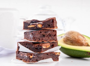 Homemade vegan avocado brownie dessert, sweet healthy alternative vegetarian food dessert with avocado and kerob, on white kitchen table copy space