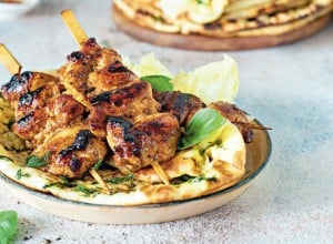 Grilled chicken kebabs (chicken skewers) with herbed garlic butter naan tortillas and Greek tzatziki sauce. Delicious street food.

; Shutterstock ID 1781714780; purchase_order: Nisa; job: BBQ 2022.; client: Spar Hrvatska; other: 