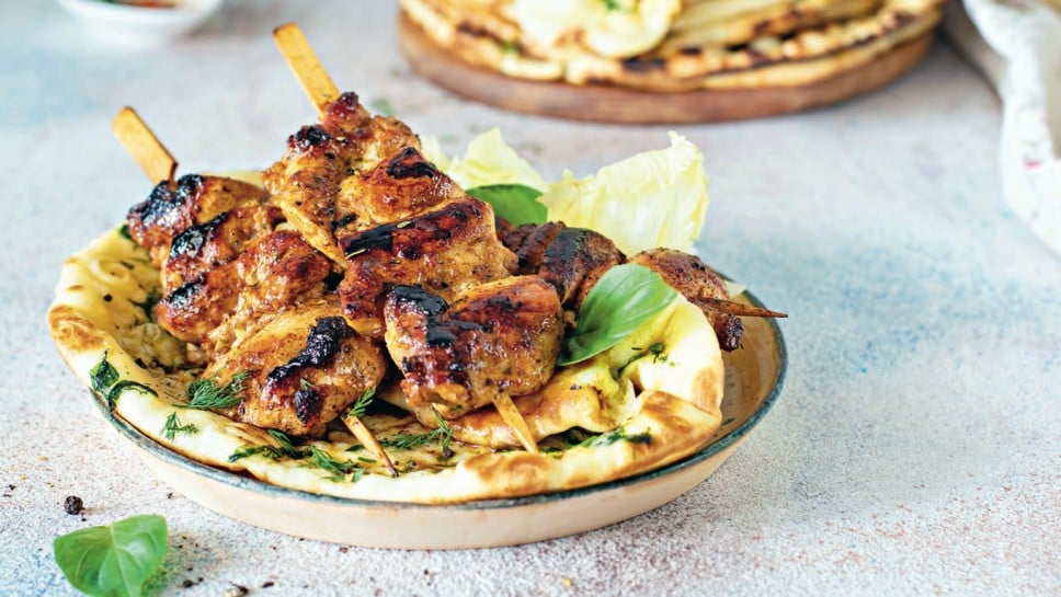 Grilled chicken kebabs (chicken skewers) with herbed garlic butter naan tortillas and Greek tzatziki sauce. Delicious street food.

; Shutterstock ID 1781714780; purchase_order: Nisa; job: BBQ 2022.; client: Spar Hrvatska; other: 