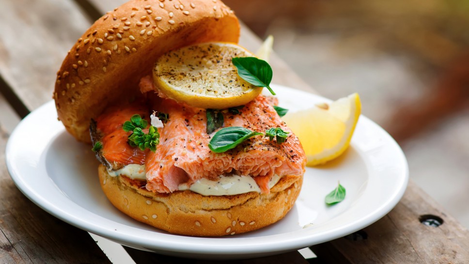 Fish burger with herb and lemon sauce.selective focus