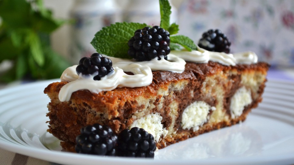 Baked Sweet Cottage Cheese Casserole decorated Whipped cream, fresh Blackberries and green leaves of Mint. Autumn and winter are the perfect times to enjoy a warm, easy-to-make casserole.