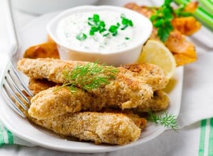 Fish Fingers and Sweet Potato Oven-Fries with tartare sauce. selective focus