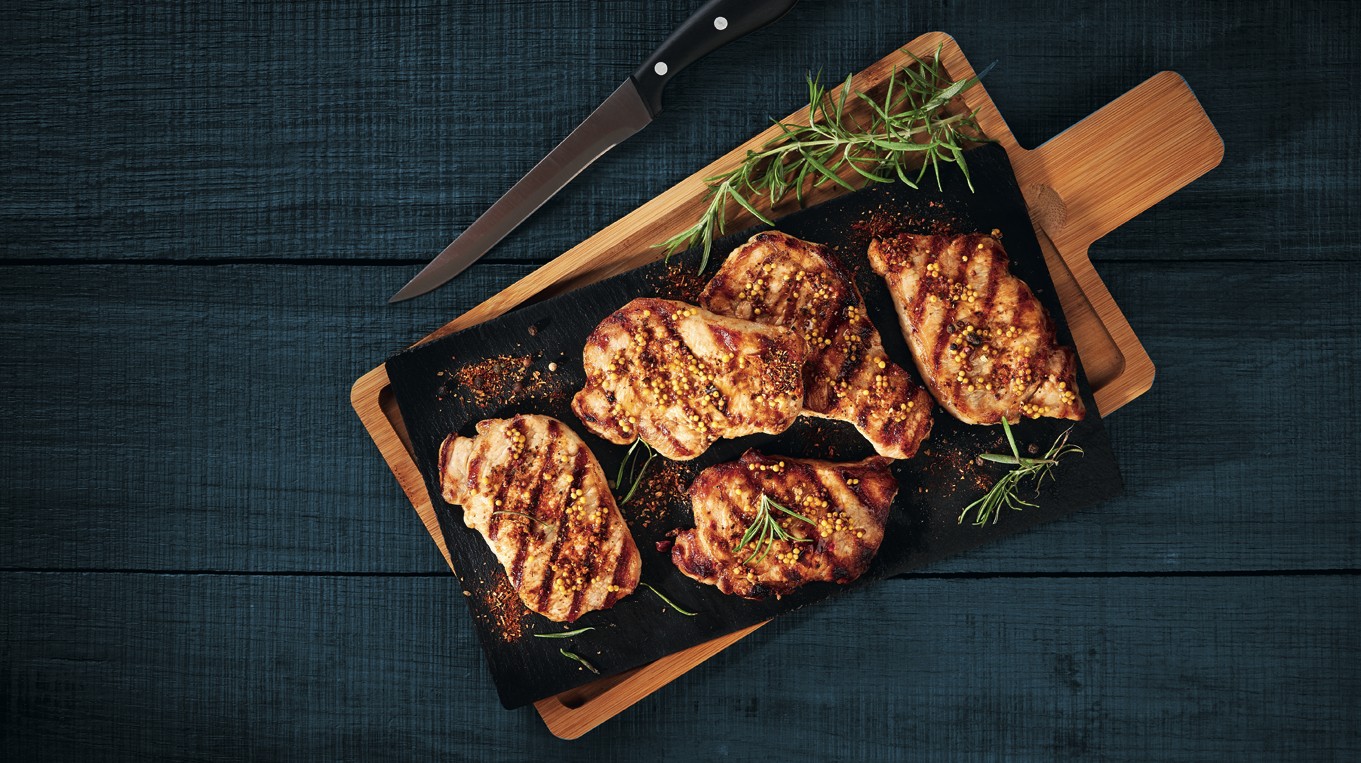 Fried pork slices served on a stone cutting board