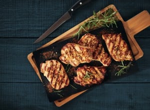Fried pork slices served on a stone cutting board