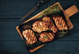 Fried pork slices served on a stone cutting board