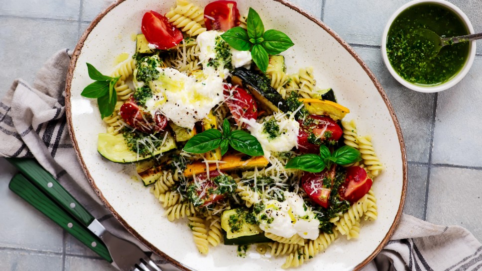 Pasta with grilled zuccini, buratta and pesto and Basil . top weiv.selective focus