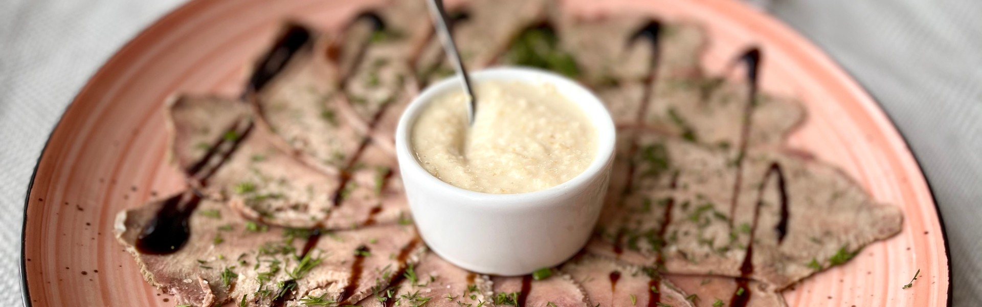 Cold appetizer. Beef tongue with horseradish sauce.