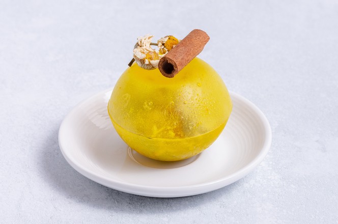 Yellow tea bomb in plate isolated