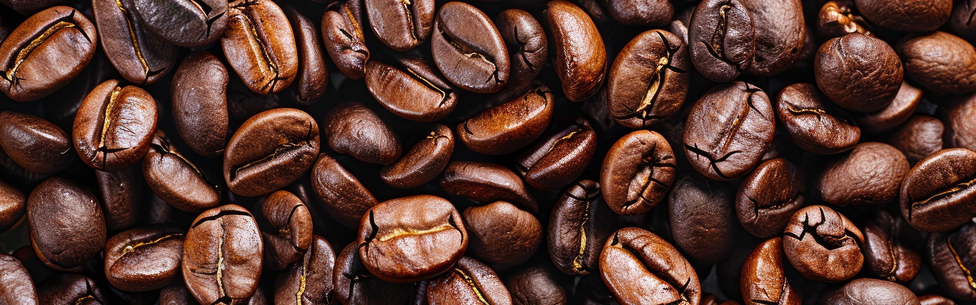 Photo of Big pile of fresh roasted coffee beans close up. Food photo for backdrops or recipes