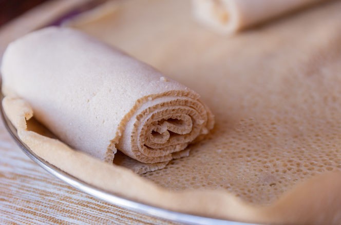 Injera, a fermented flatbread made with teff flour. It is a staple food of Ethiopia, Eritrea, Somalia and Djibouti