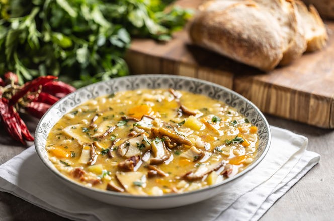 Homemade and tasty soup made from wild mushrooms, bacon, carrots and barley groats.