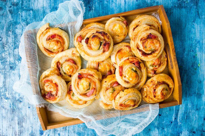 Pizza rolls pastry on a wooden cutting board